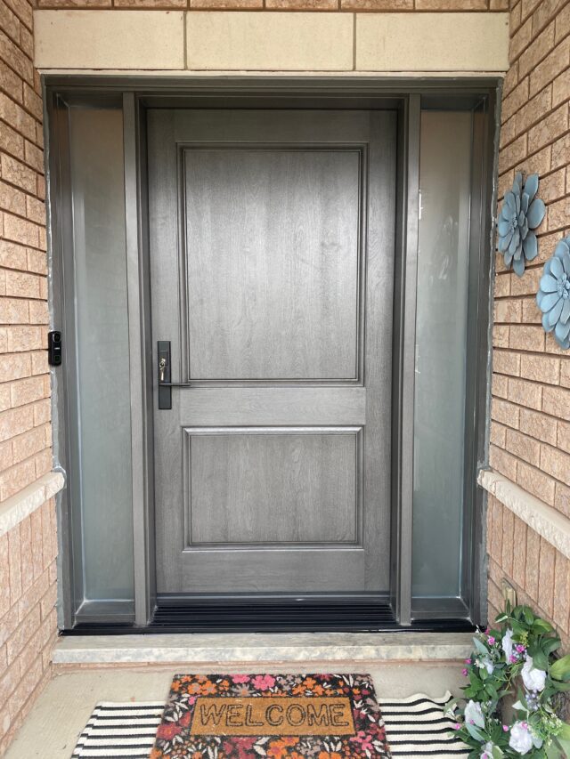 Grey entry door installation in Scarborough with two sidelights